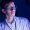 young intern operating experimental equipment in neon-lit discovery center of future